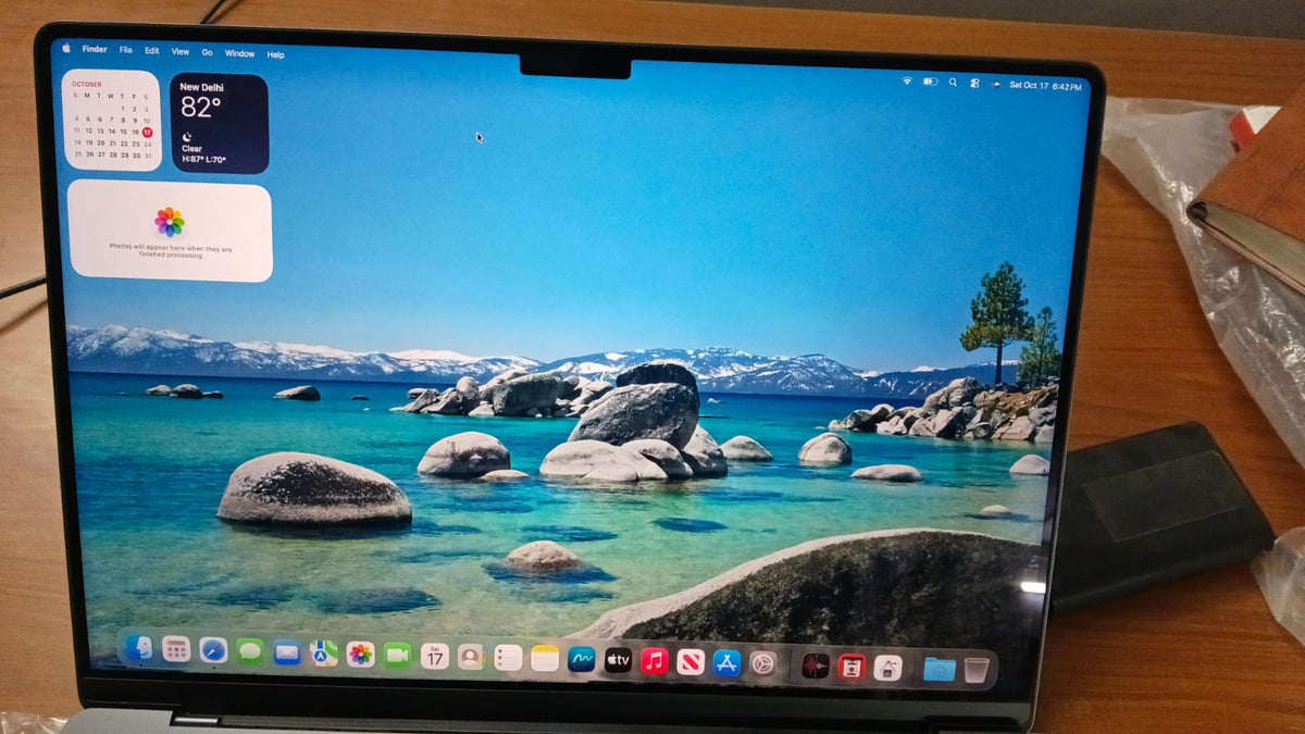 Apple MacBook Pro powered on showing macOS desktop