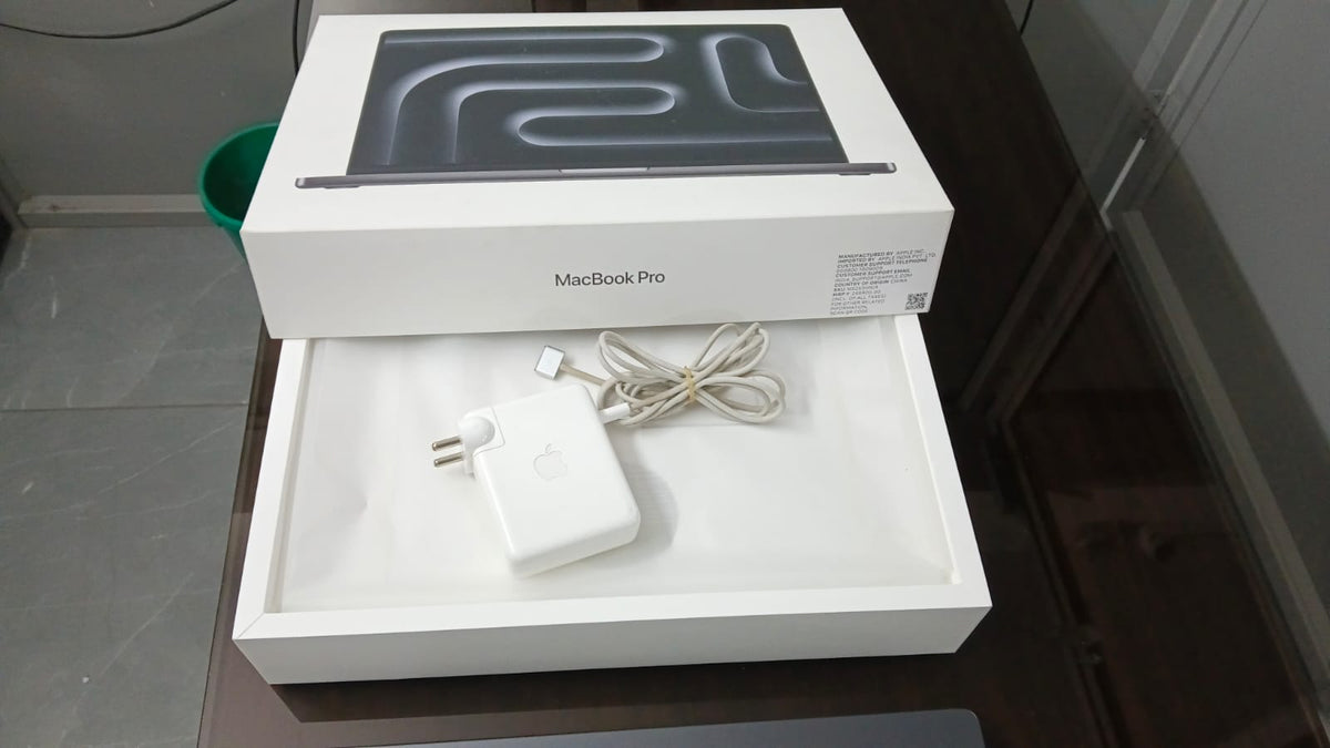 Apple MacBook Pro box and included power adapter and charging cable